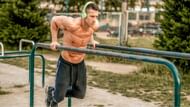 Body weight chest dips are one of the best chest workouts that can be done anywhere. (Image via Pinterest)
